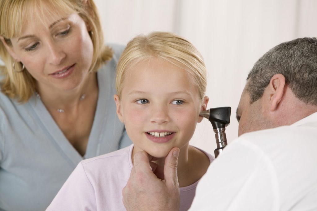 Doctor Examining Young Girl